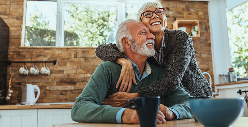 Happy older couple in their new home