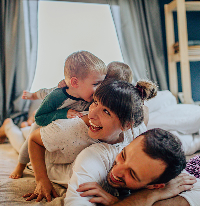 Family playing in the family room of their home